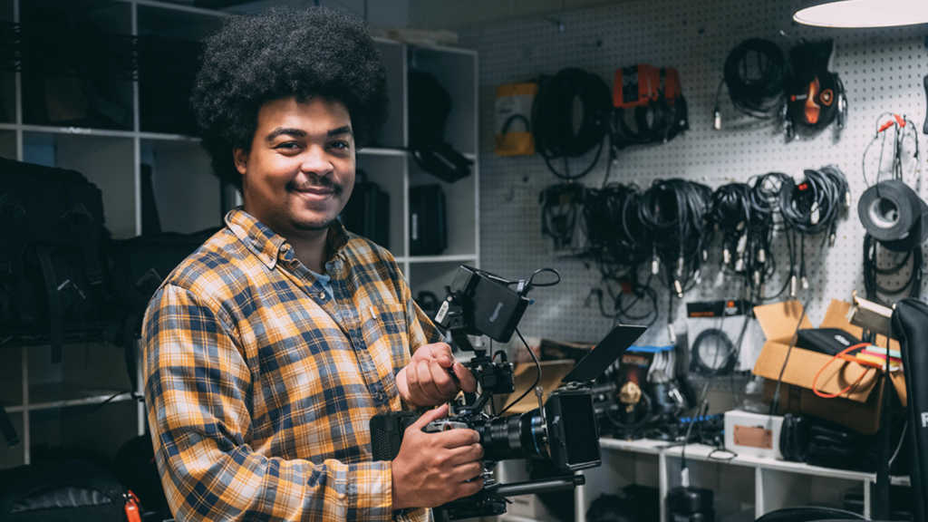 UNCG undergraduate student Taylee Gaillard holds a camera in a CVPA film lab